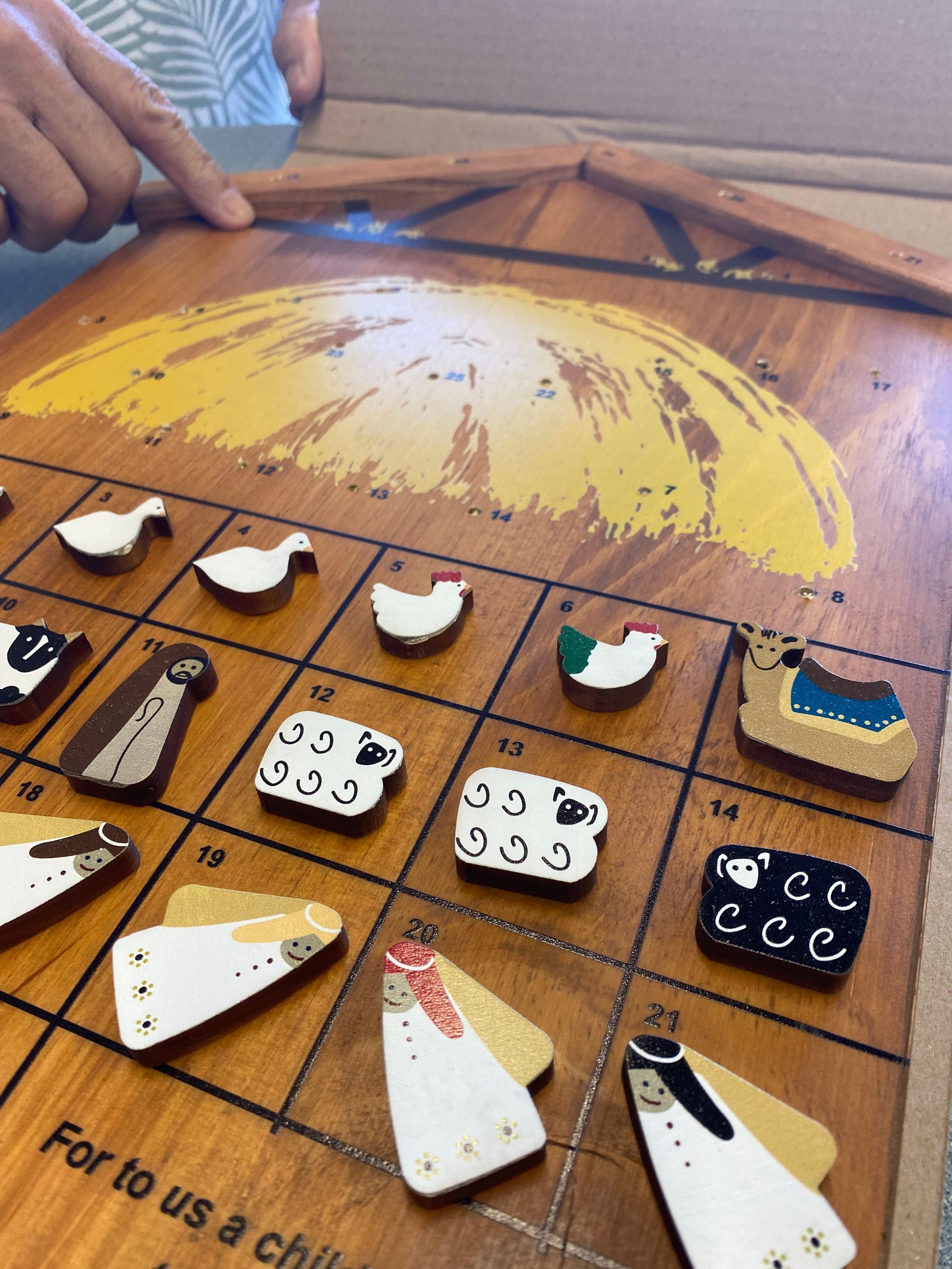 A wooden board with the words for to us a child on it