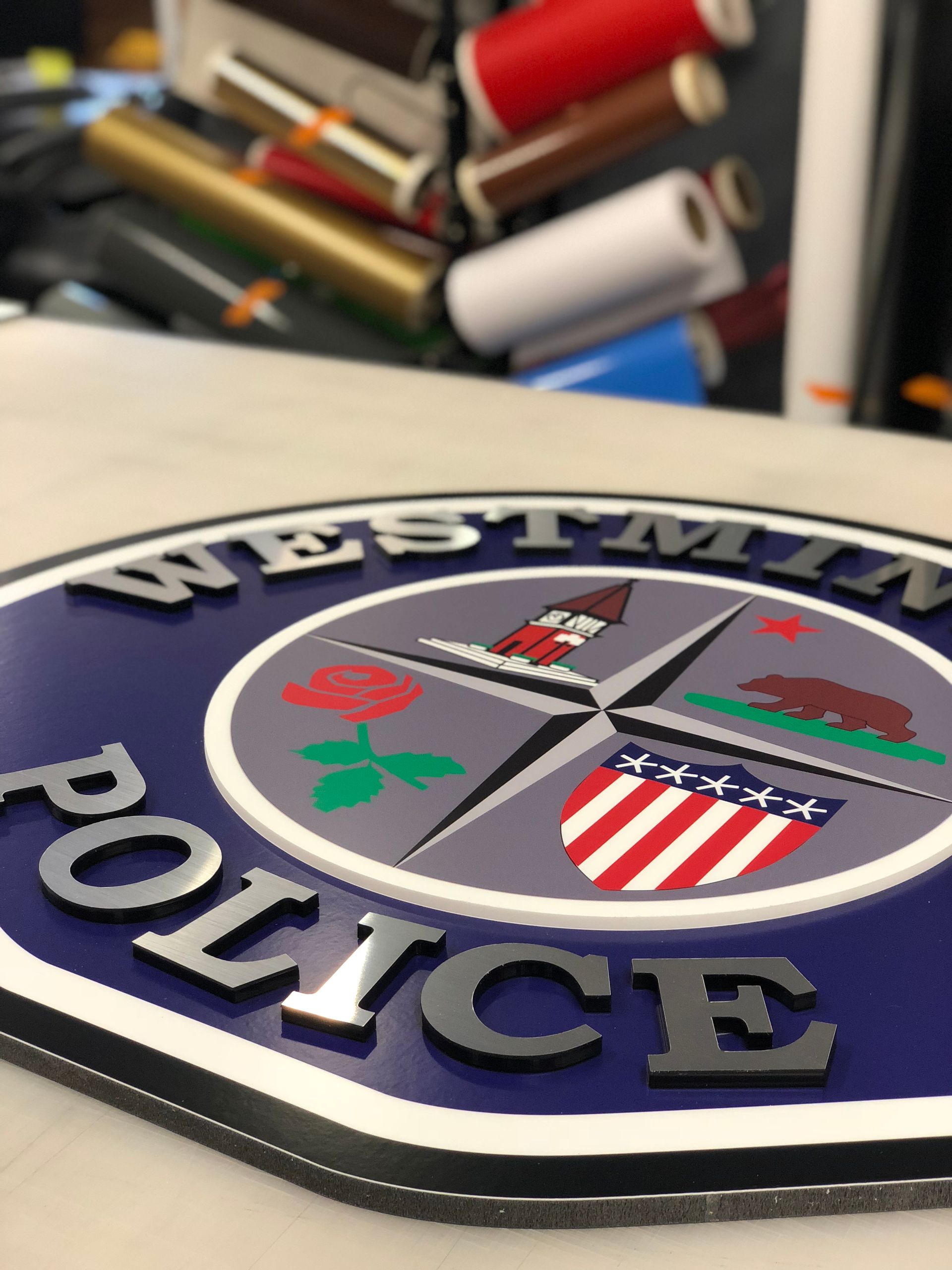 A westminster police sign is sitting on a table