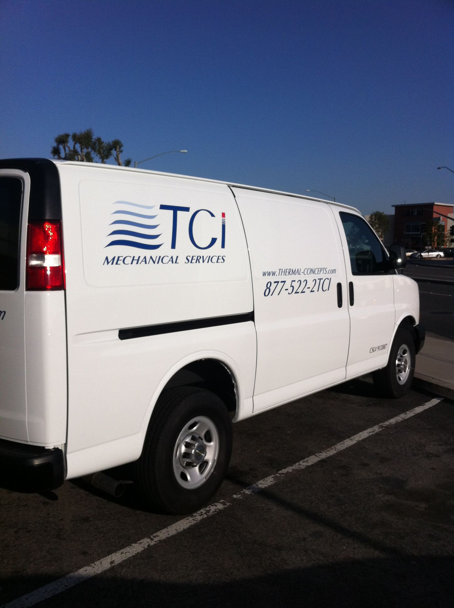 A white van with the word tci on it