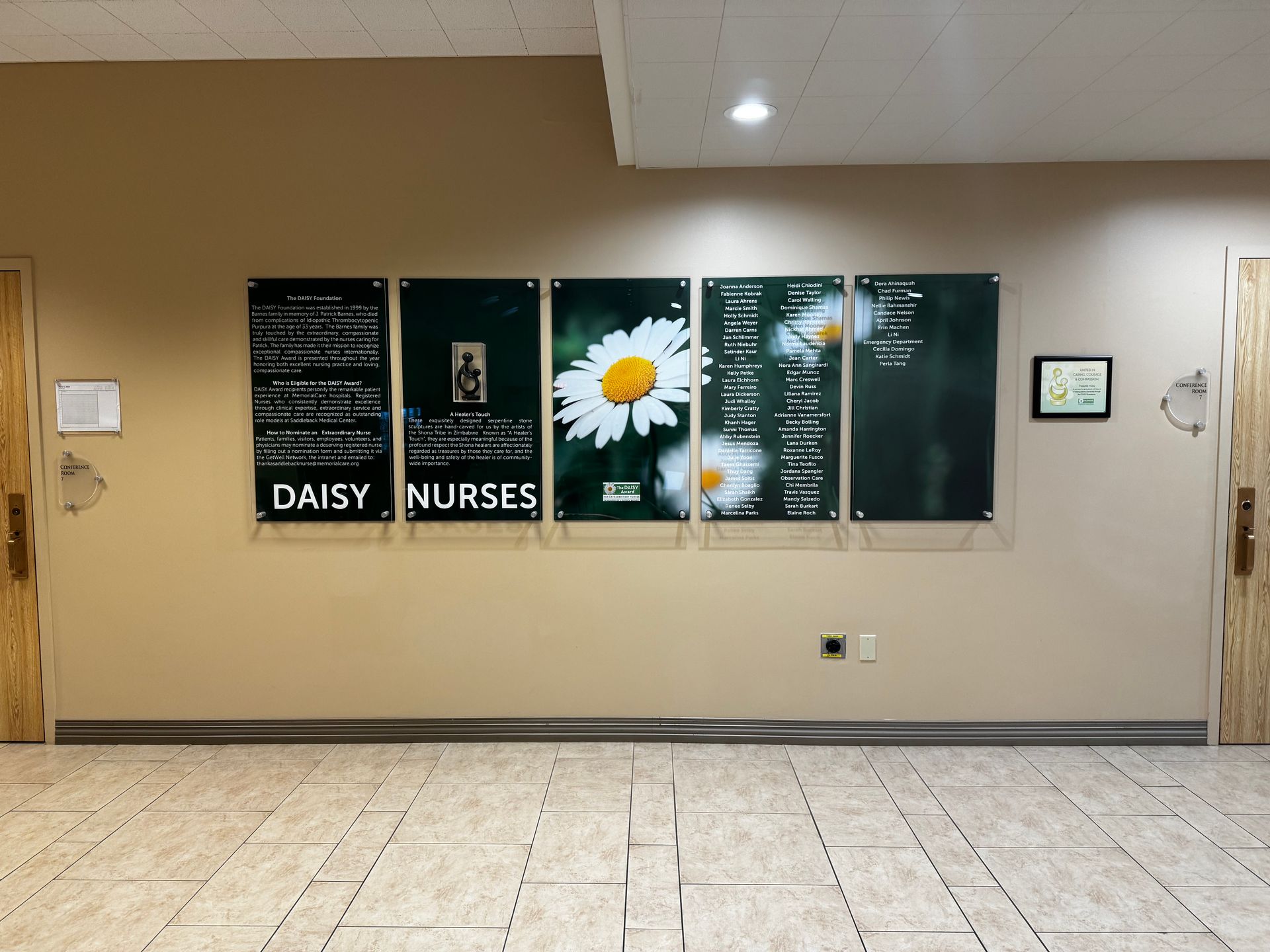 A hallway with a daisy nurses sign on the wall