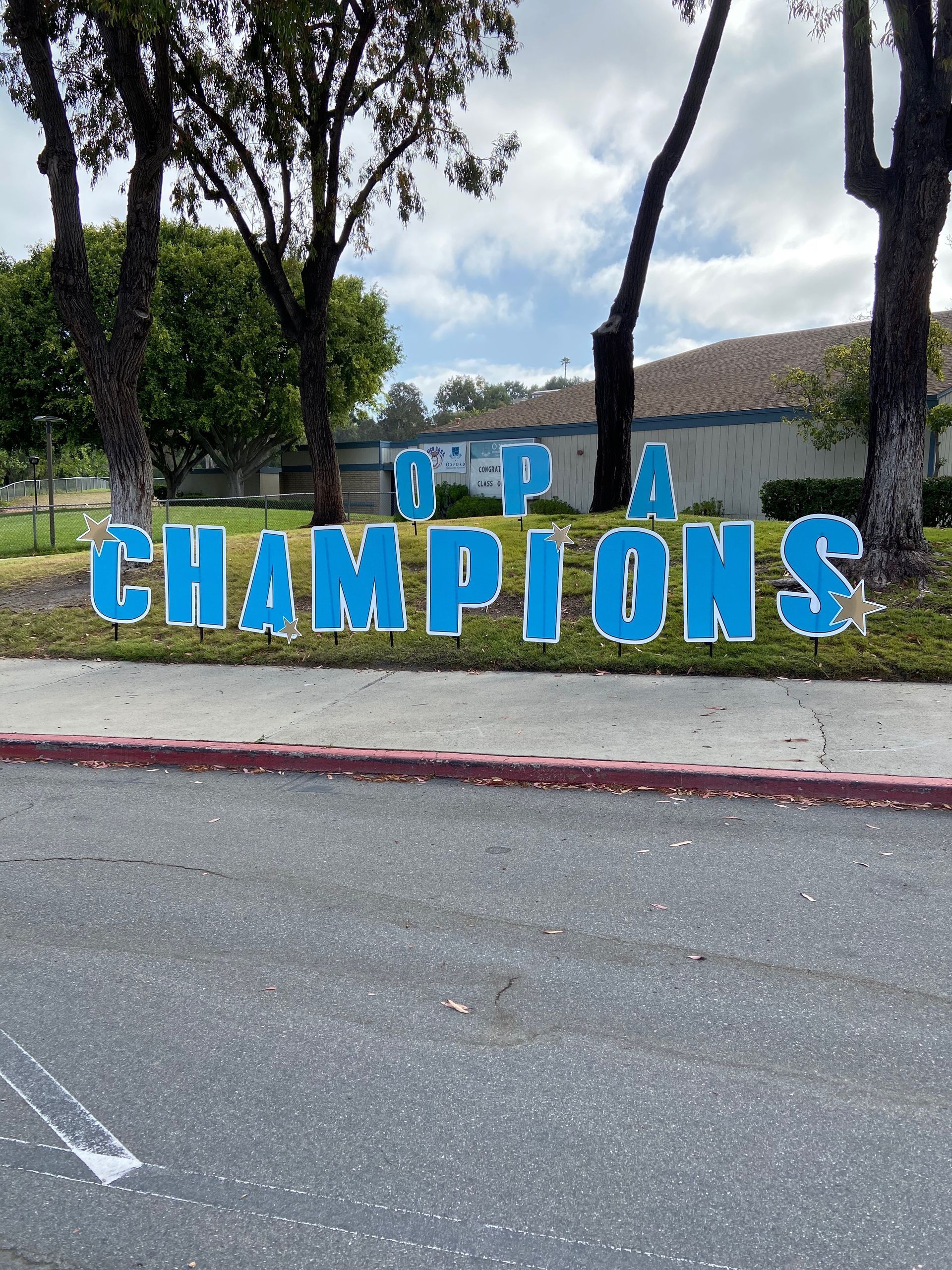 A blue sign that says champions on it