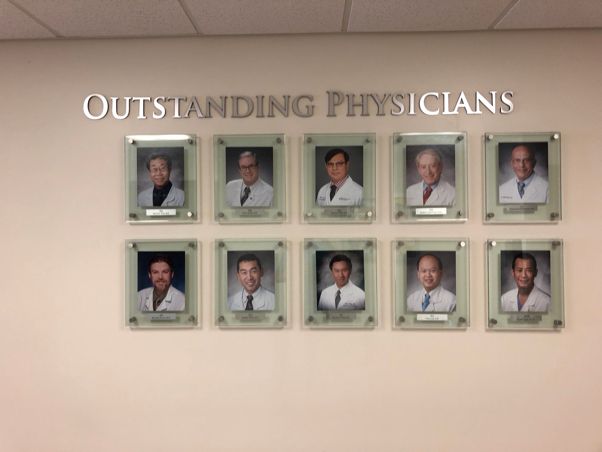 A wall with outstanding physicians written on it
