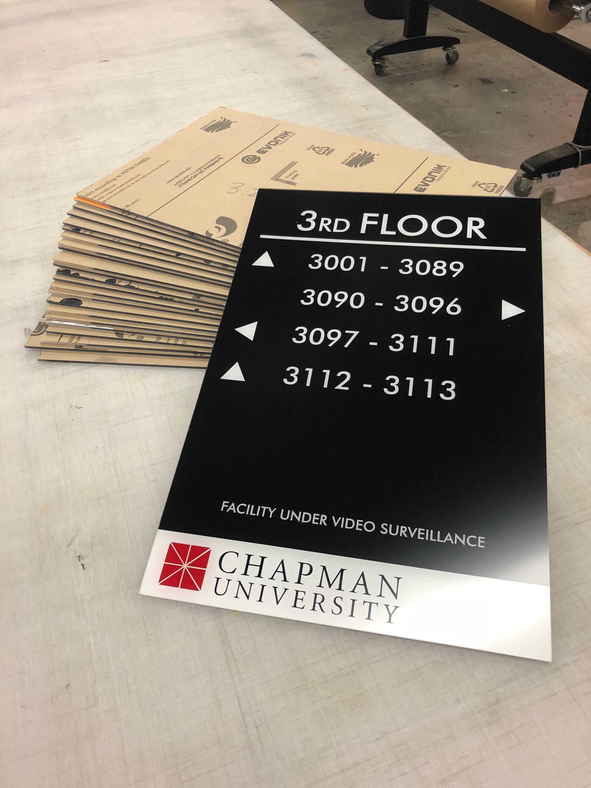 A chapman university sign sits on a table