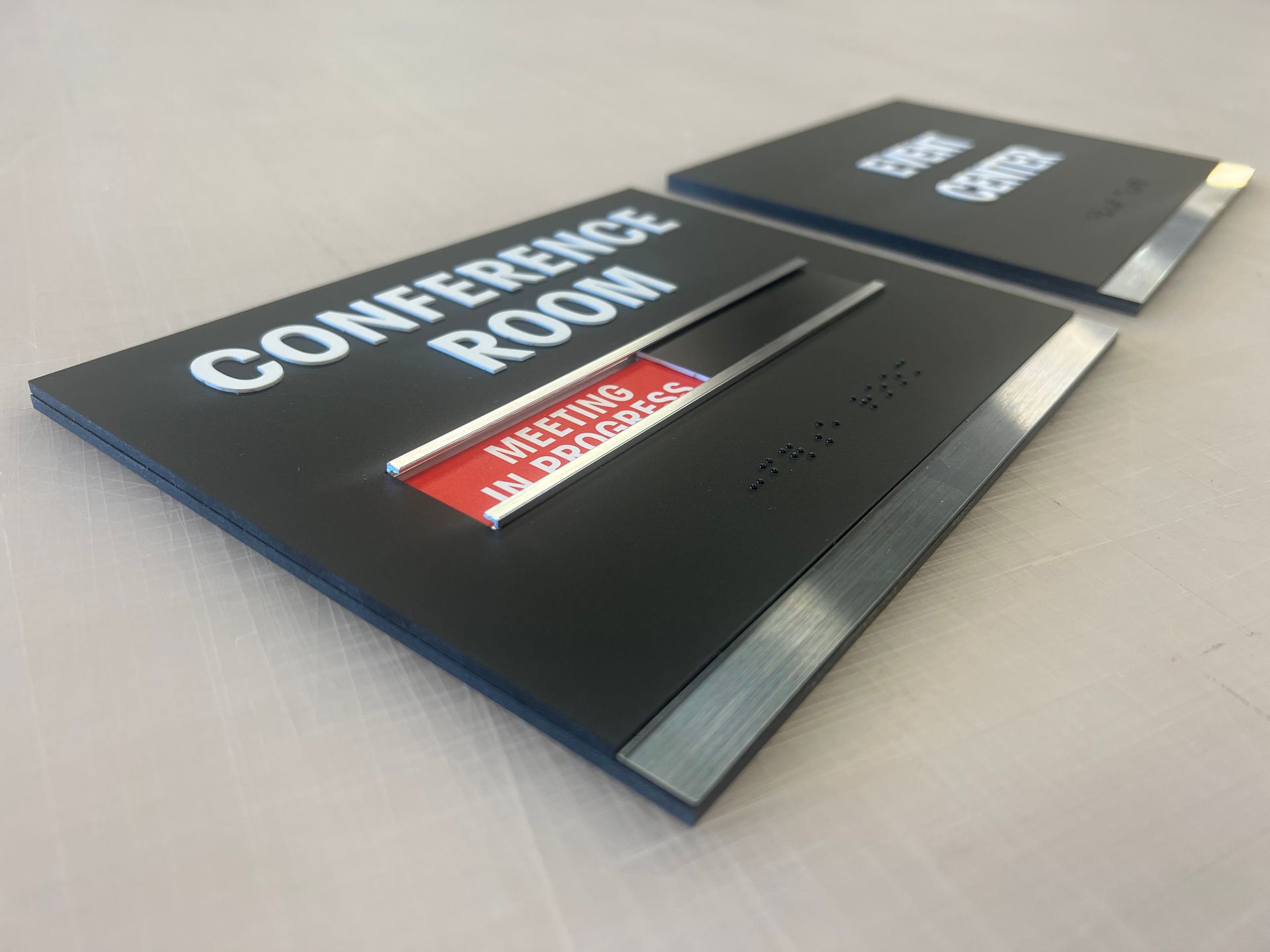 A conference room sign is sitting on a table