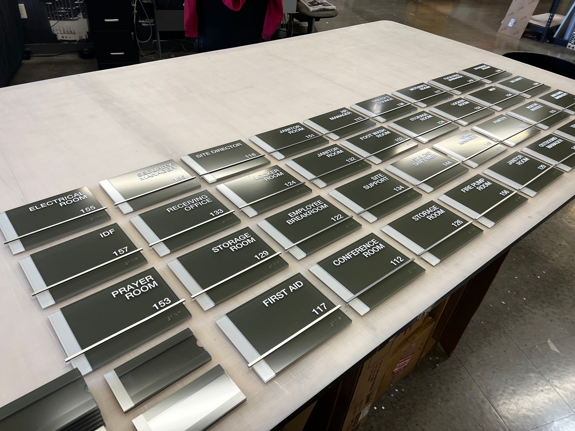 A table with a lot of name plates on it