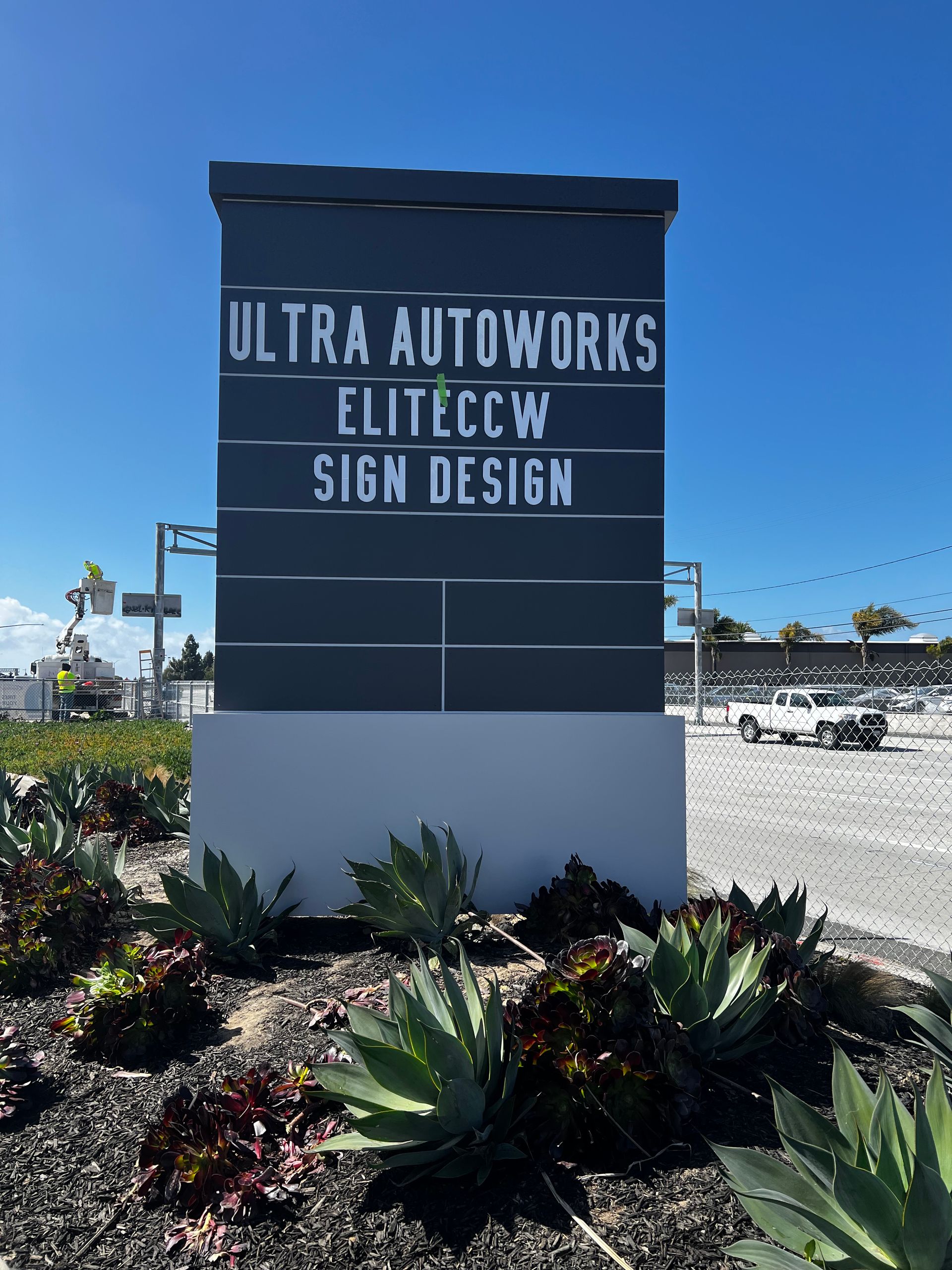 A sign that says ultra autoworks eliteccw sign design