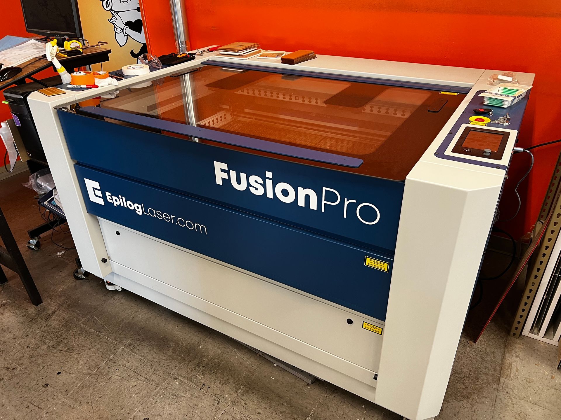 A fusion pro machine is sitting on a table in a room.