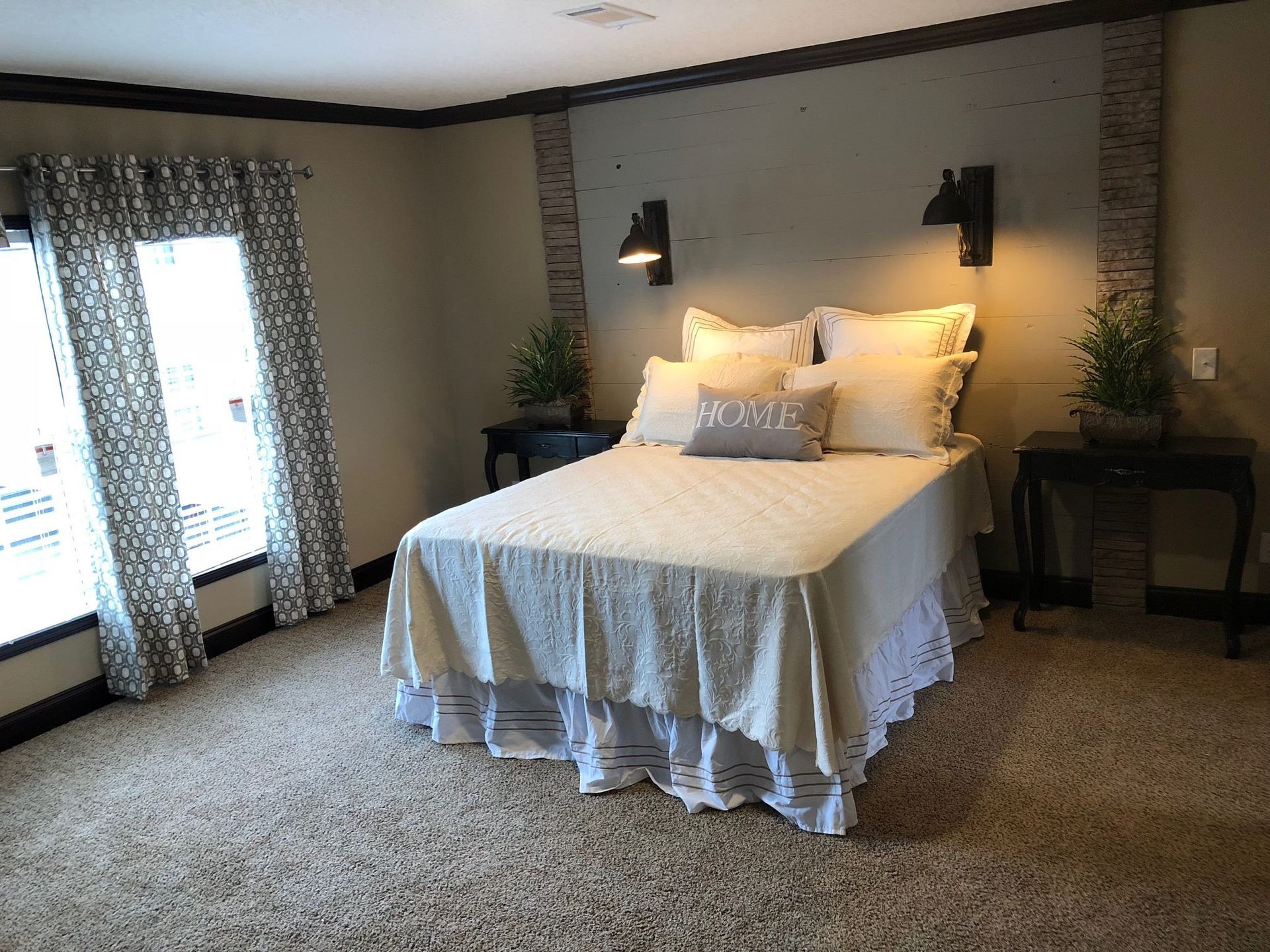 There is a large bed in the middle of the room.