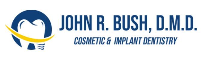 Logo for John R. Bush, D.M.D. Cosmetic & Implant Dentistry. Features a tooth design within a blue circle with a yellow arc.