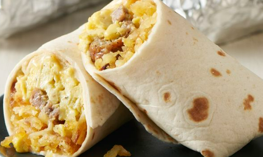 Two breakfast burritos filled with scrambled eggs, sausage, and hash browns, wrapped in toasted flour tortillas.