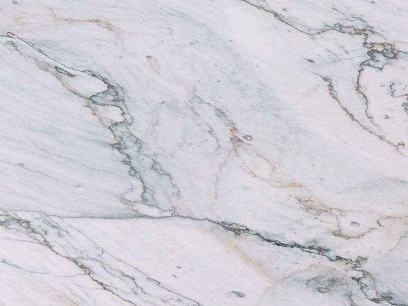 A close up of a white granite counter top