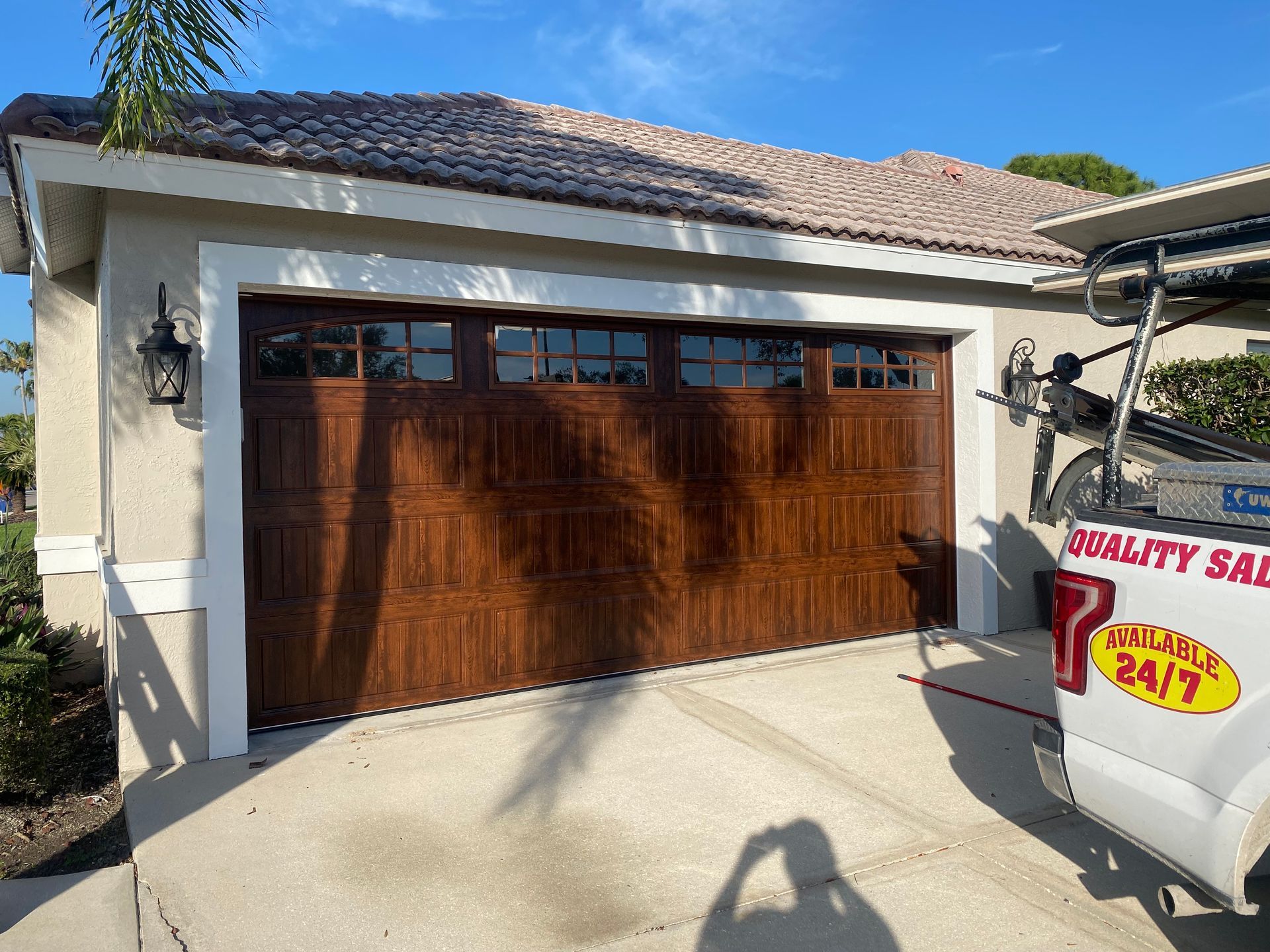 A wooden garage door with a golf cart parked in front of it.