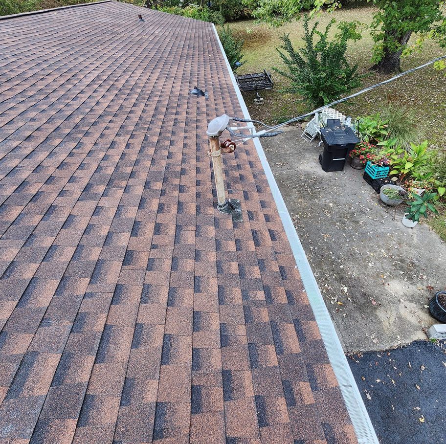An aerial view of a roof with gutter guard