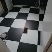 Black and white checkered floor in a room.