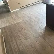 Light wood-look tile flooring in a kitchen area.