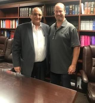 Two men are standing next to each