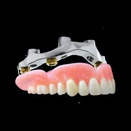 A close up of a denture on a black background.