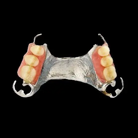 A close up of a dental prosthetic with teeth on a black background.