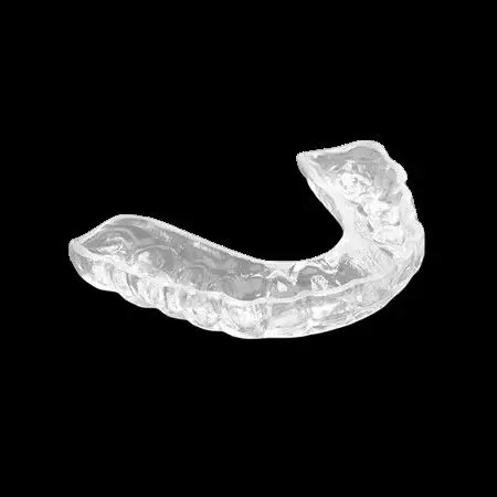 A clear mouth guard on a black background.