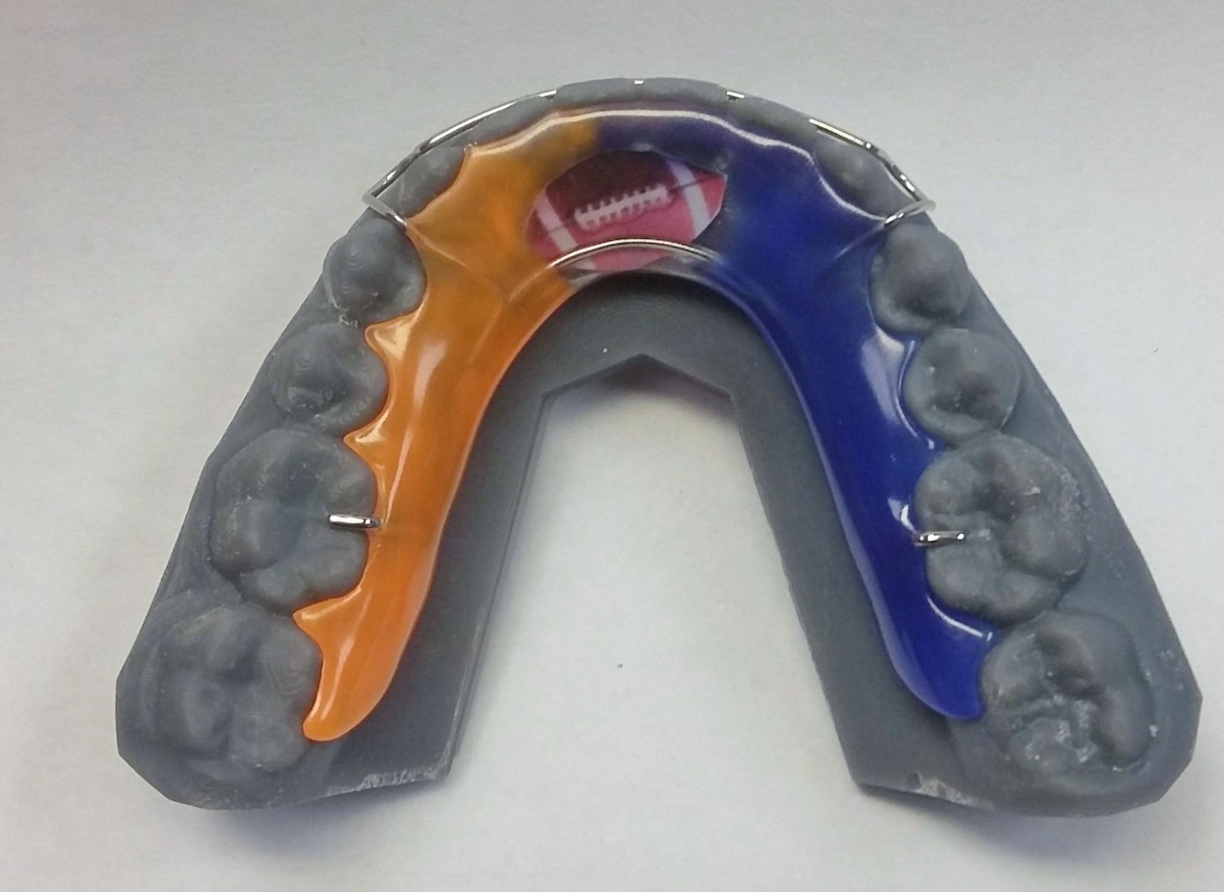 A model of a mouth with a football on it