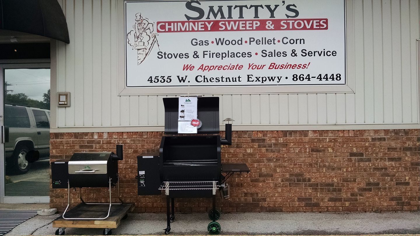 A sign for smithy 's chimney sweep and stoves