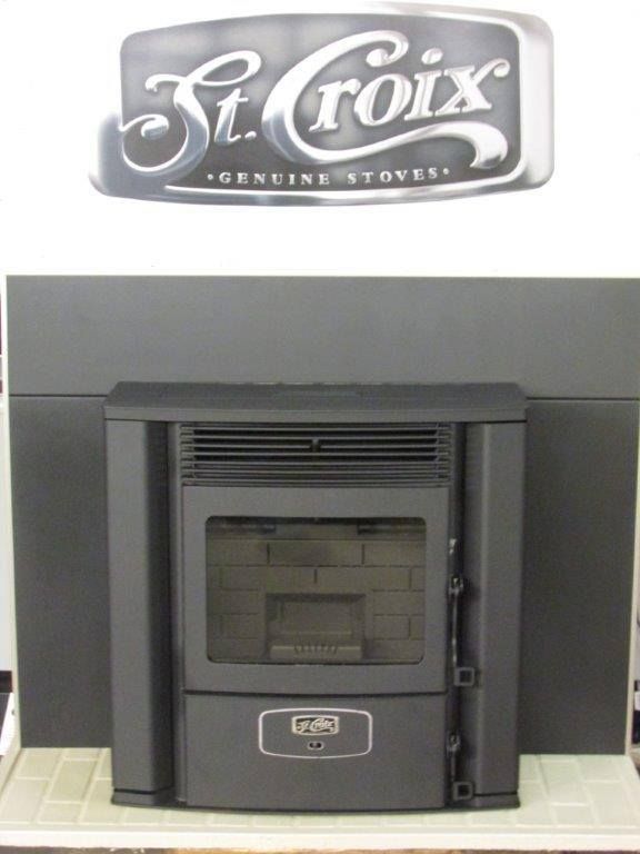 A st. croix stove is sitting in front of a white wall