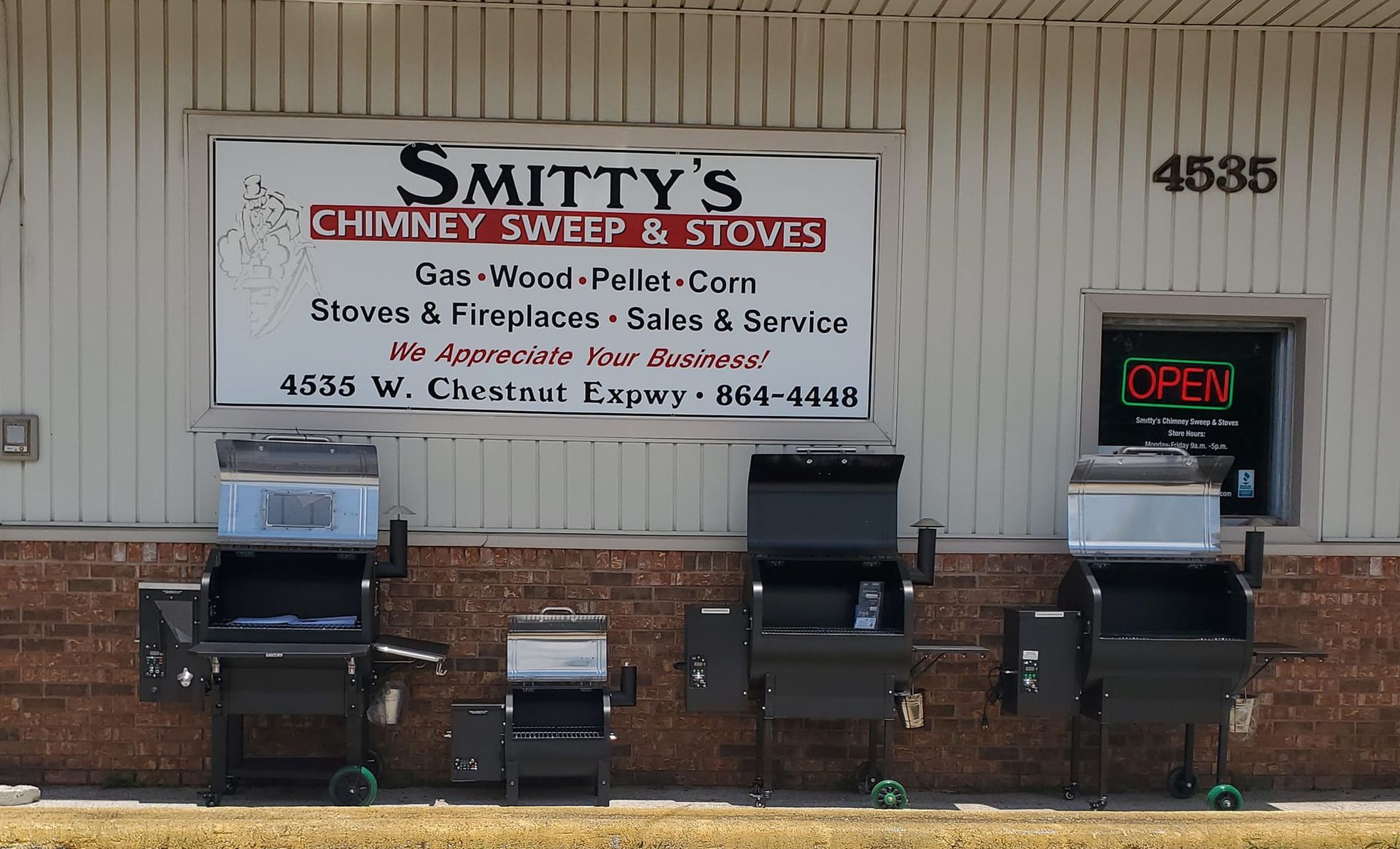 A sign for smithy 's chimney sweep and stoves