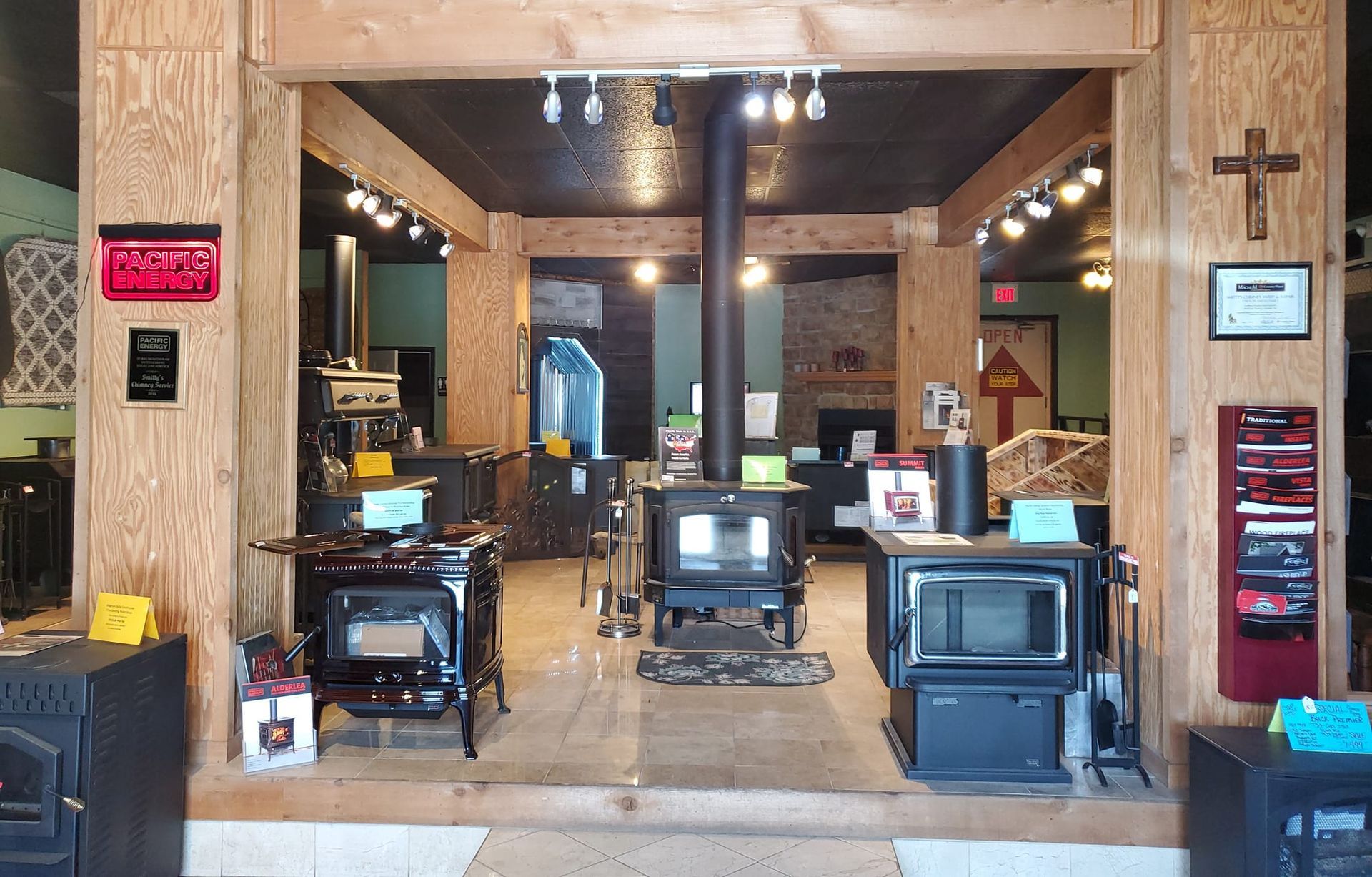 A store filled with a variety of wood stoves