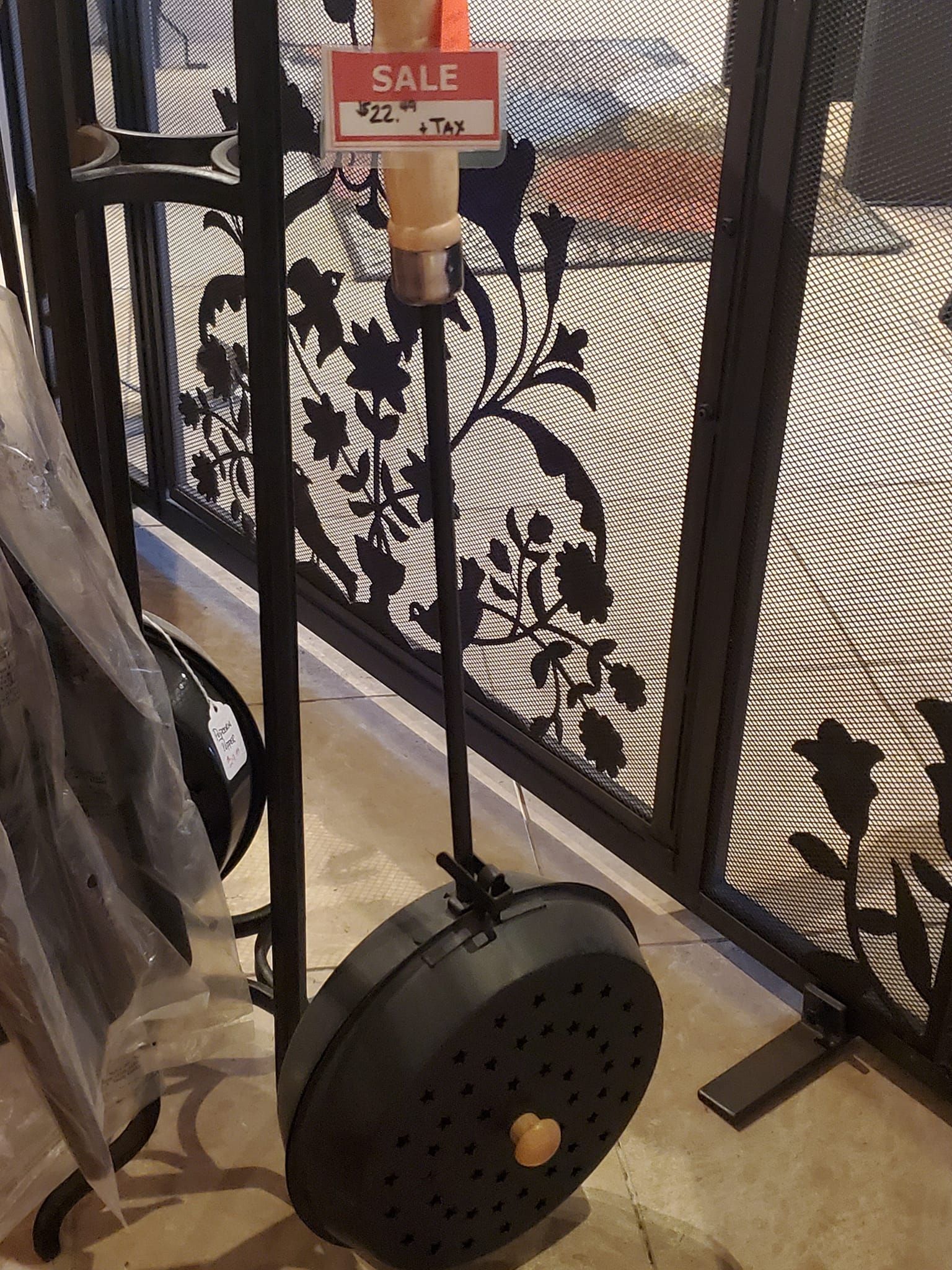 A black object with a sale sign on it