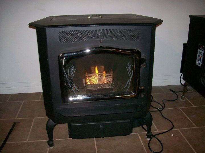 A black stove with a flame coming out of it