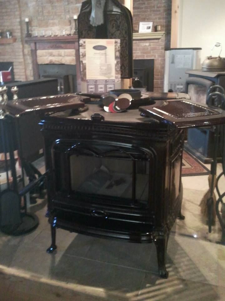 A black wood stove is sitting in a living room