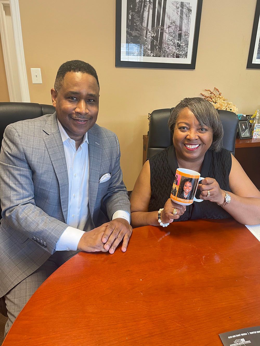 A man and a woman holding a mug