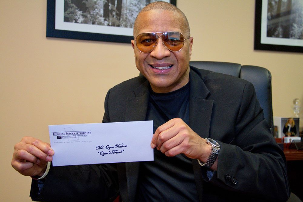 A happy client holding an envelope