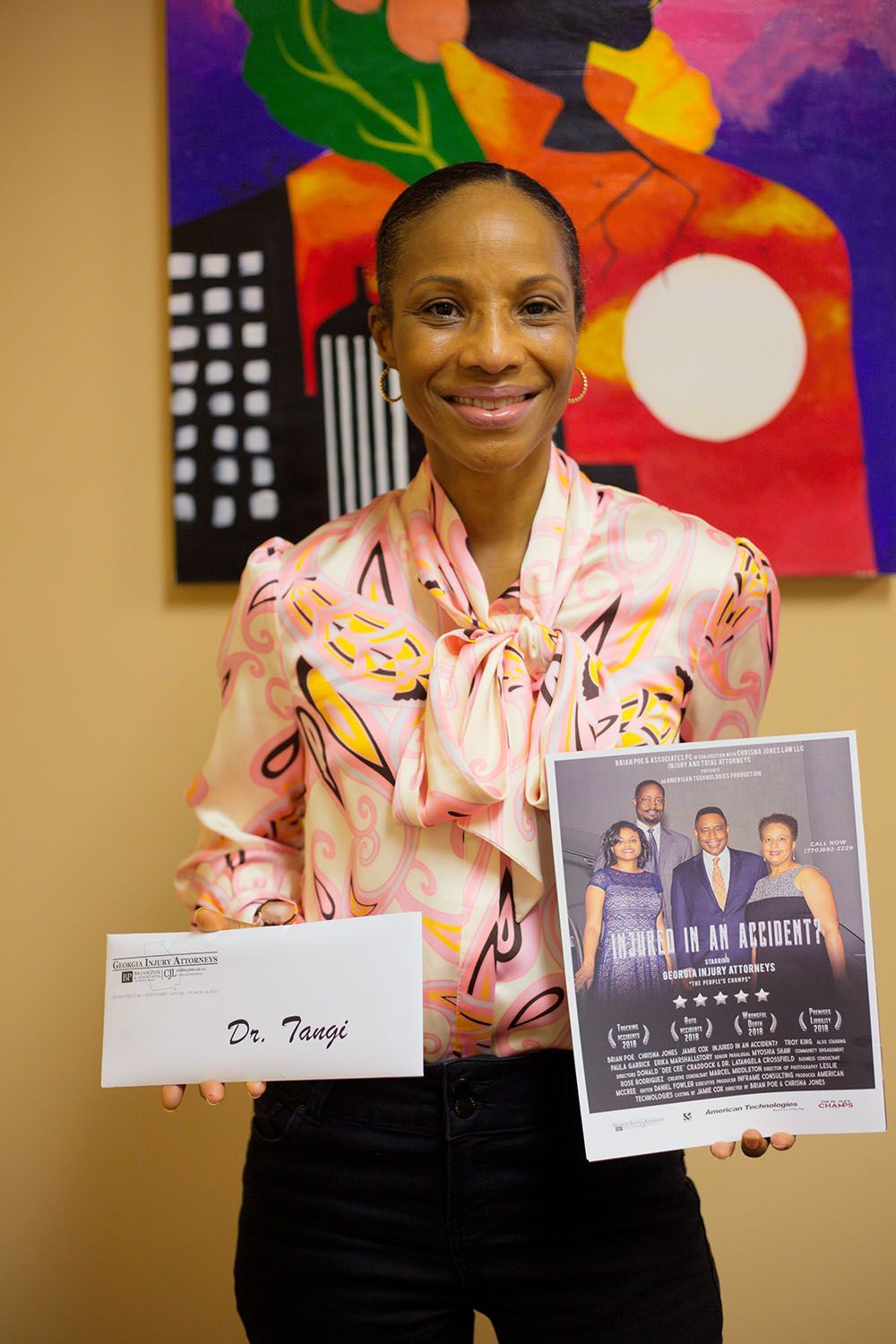 A happy client holding a check and a flyer