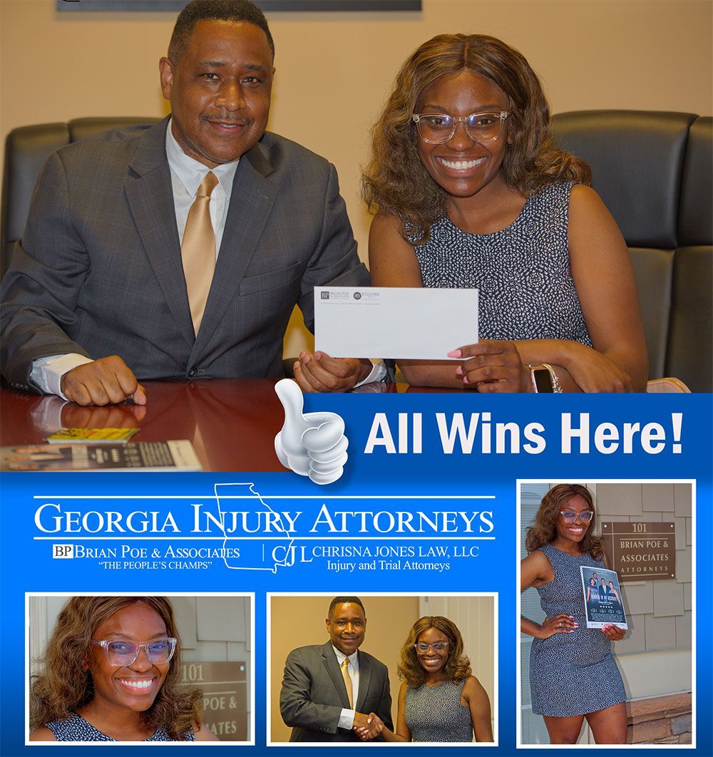 Brian D. Poe, Esq. handing a check