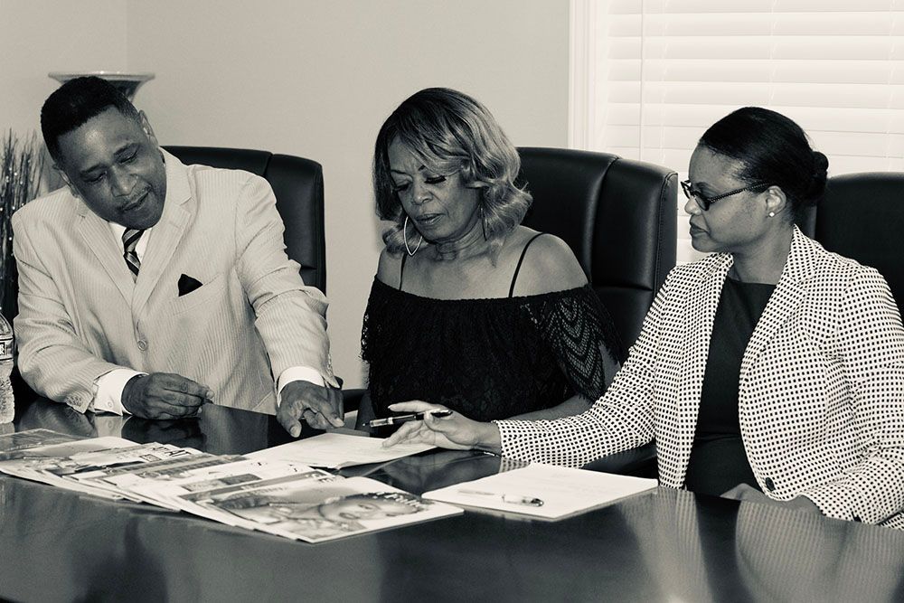 Georgia Injury Attorneys with a cheerful client