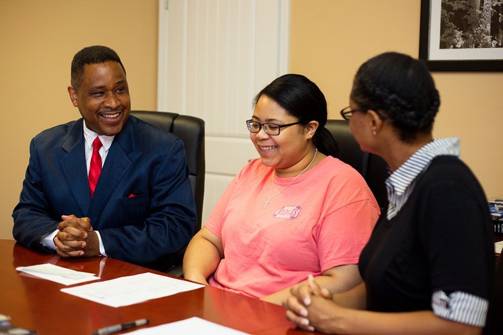 Georgia Injury Attorneys with a happy client