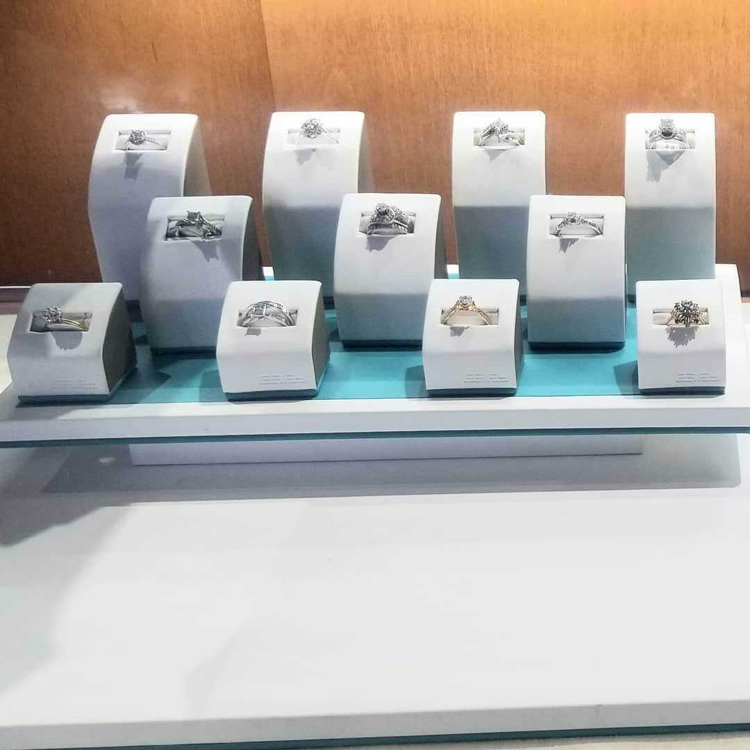 A display of rings on a table in a store