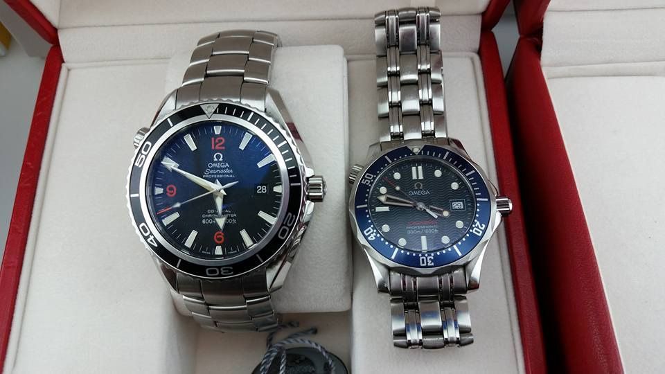 A couple of watches are sitting next to each other in a box