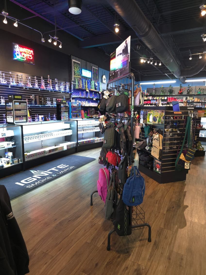 A store filled with lots of items including backpacks and hats.