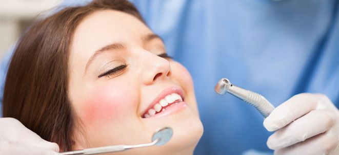 Woman undergoing a dental treatment