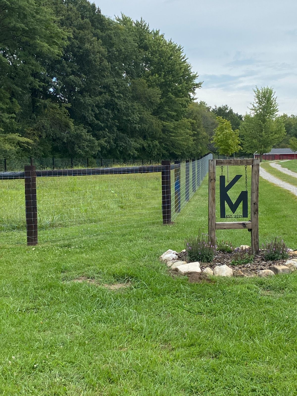 A wood-framed sign with the letters 