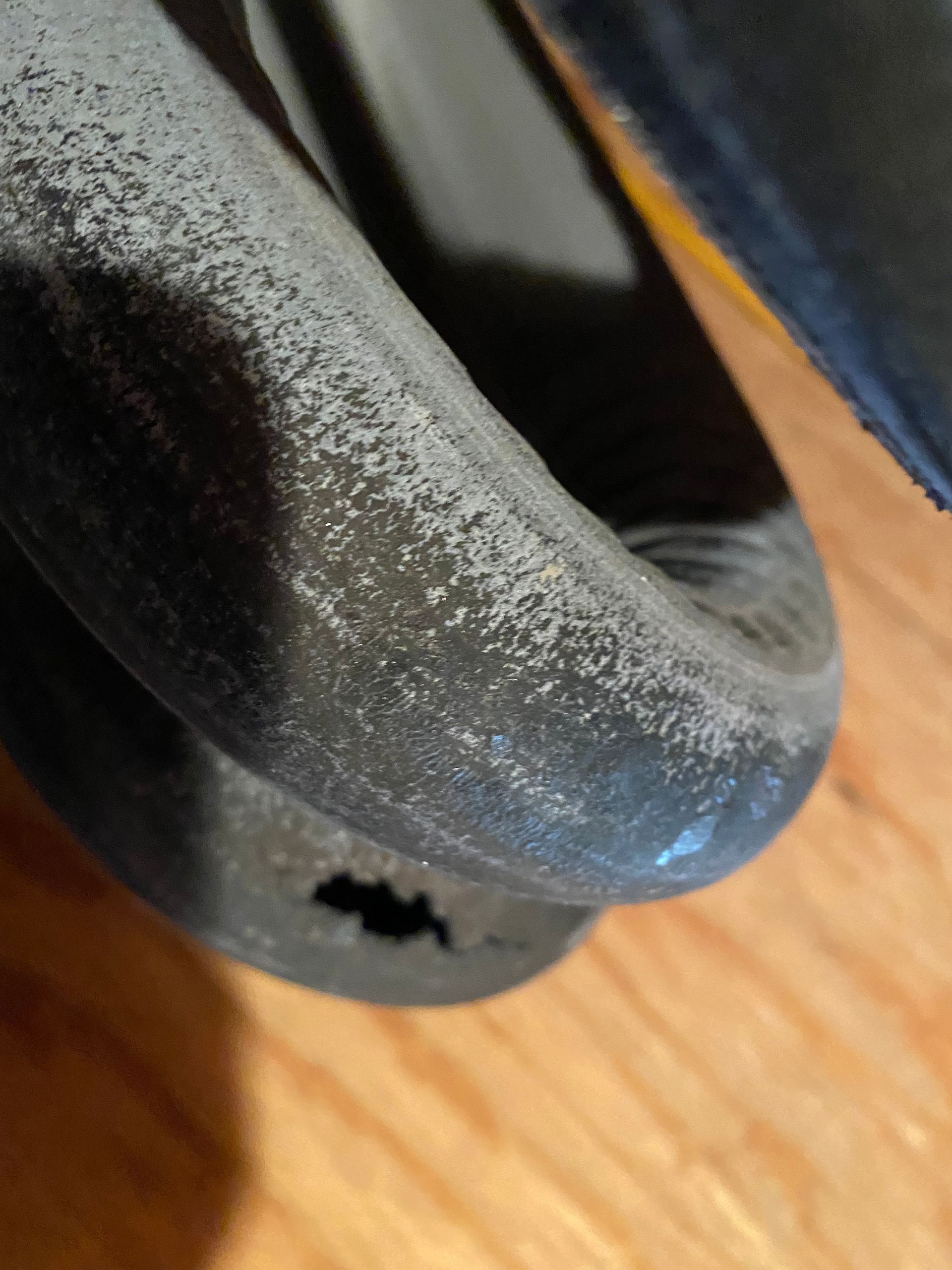 a close-up of a hose on a wooden floor