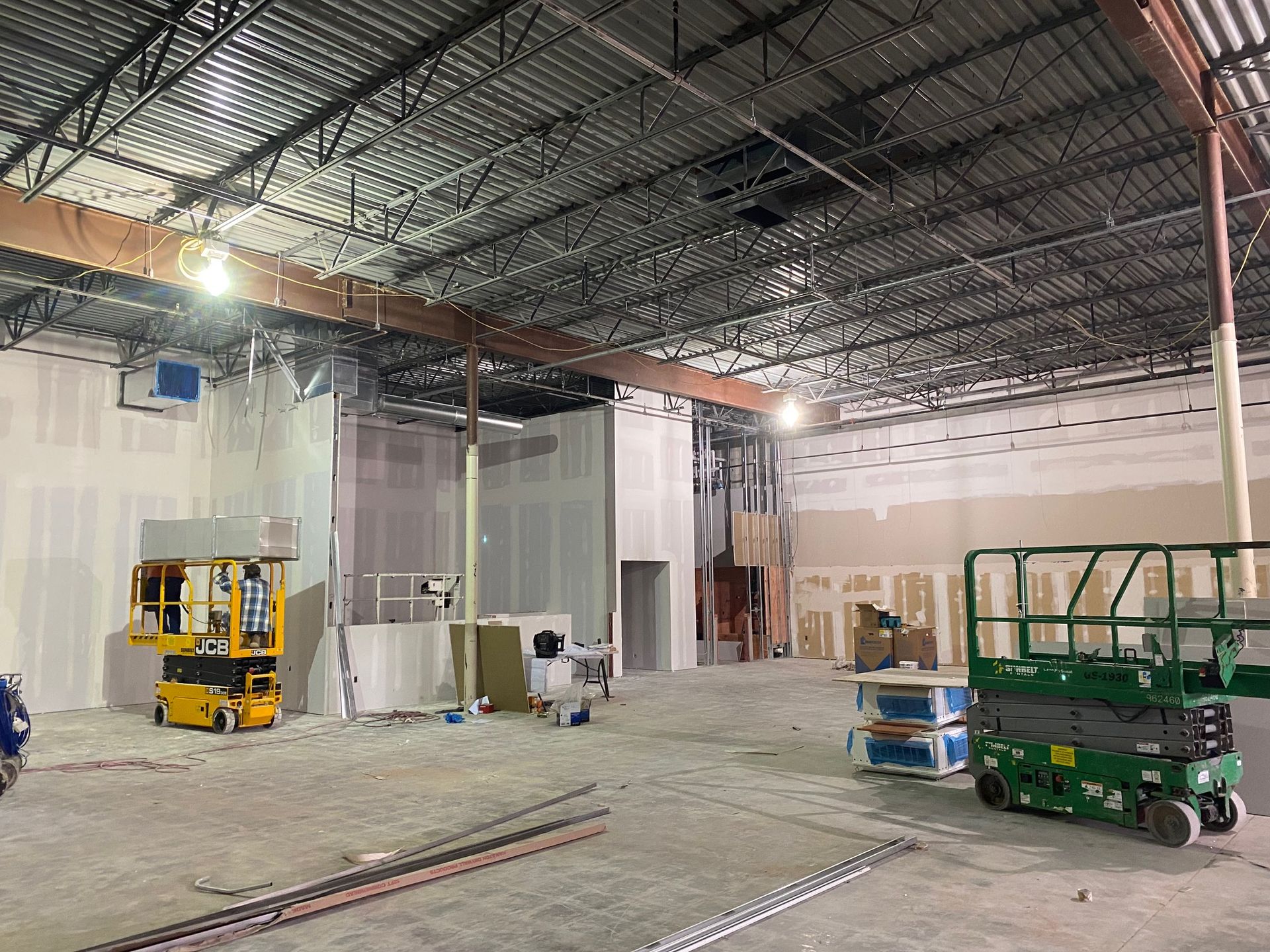 a large warehouse with a lot of machinery in it