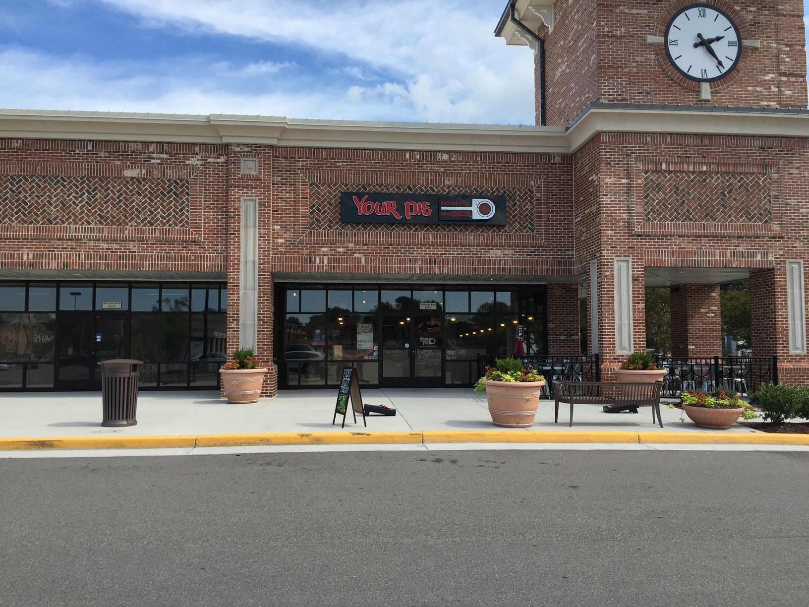 a brick building with a clock on top of it