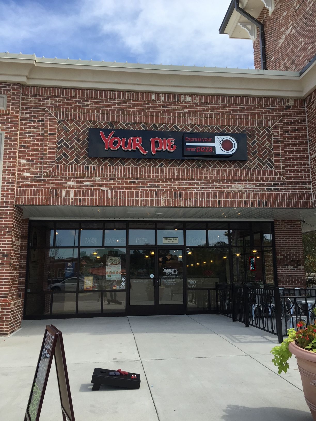 a brick building with a sign that says your dog on it