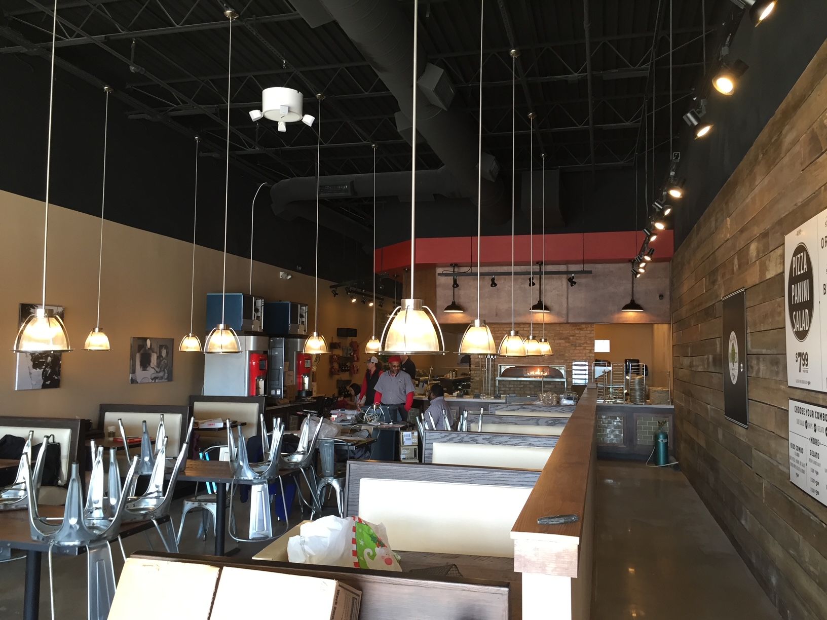 the inside of a restaurant with tables and chairs empty
