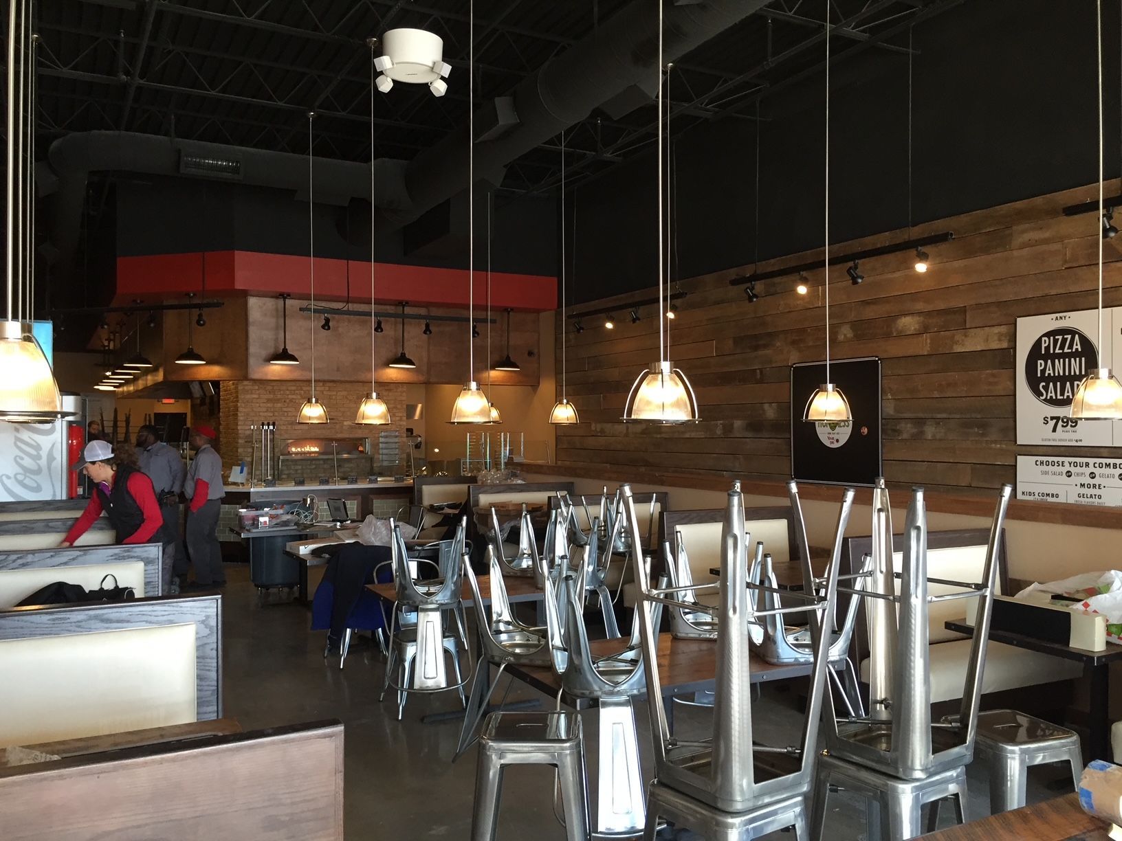 a restaurant with tables and chairs sitting upside down