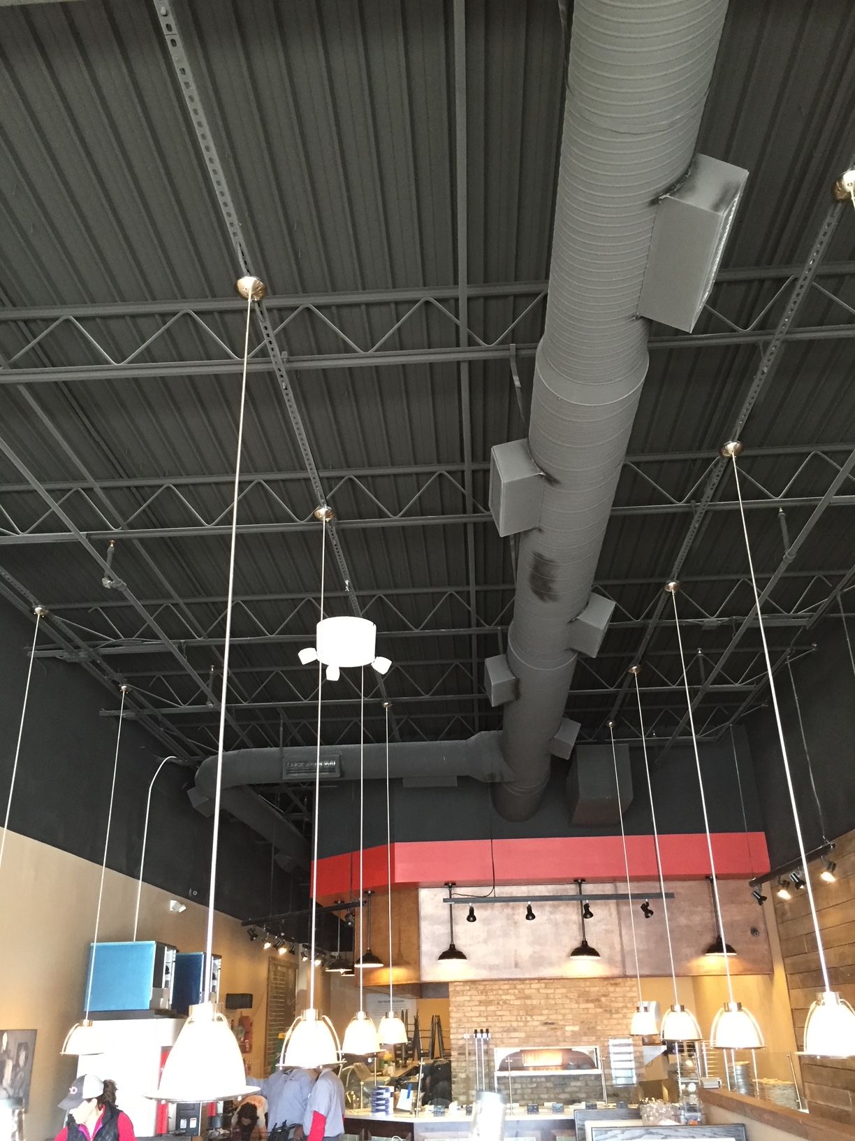 a restaurant with a lot of lights hanging from the ceiling