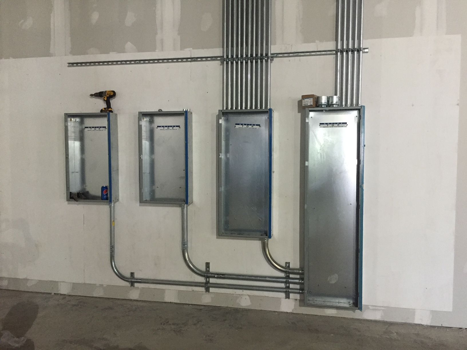 a room with a lot of electrical boxes on the wall 